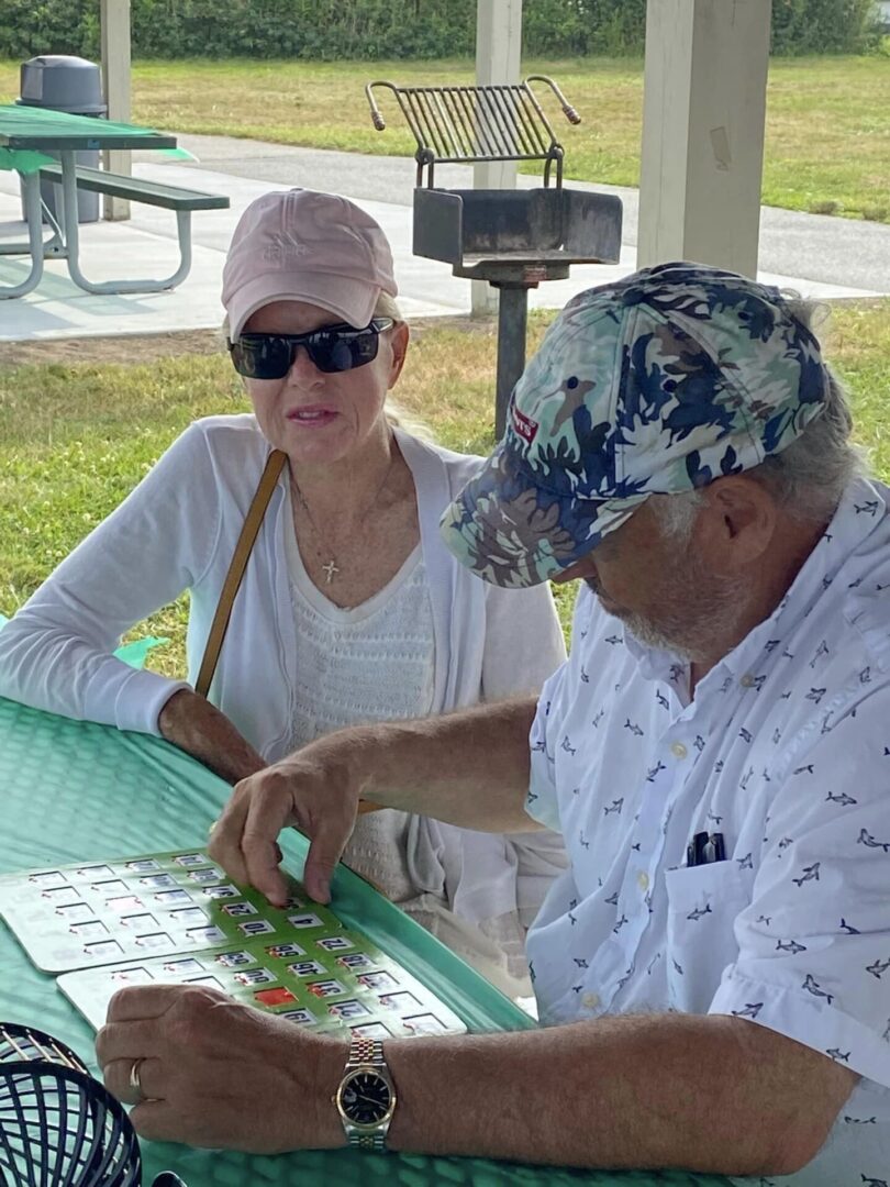 Laura and Rick play Bingo at the summer picnic