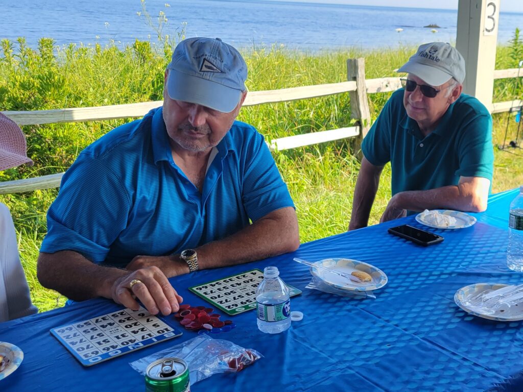 Rick concentrates on his and Laura's bingo boards
