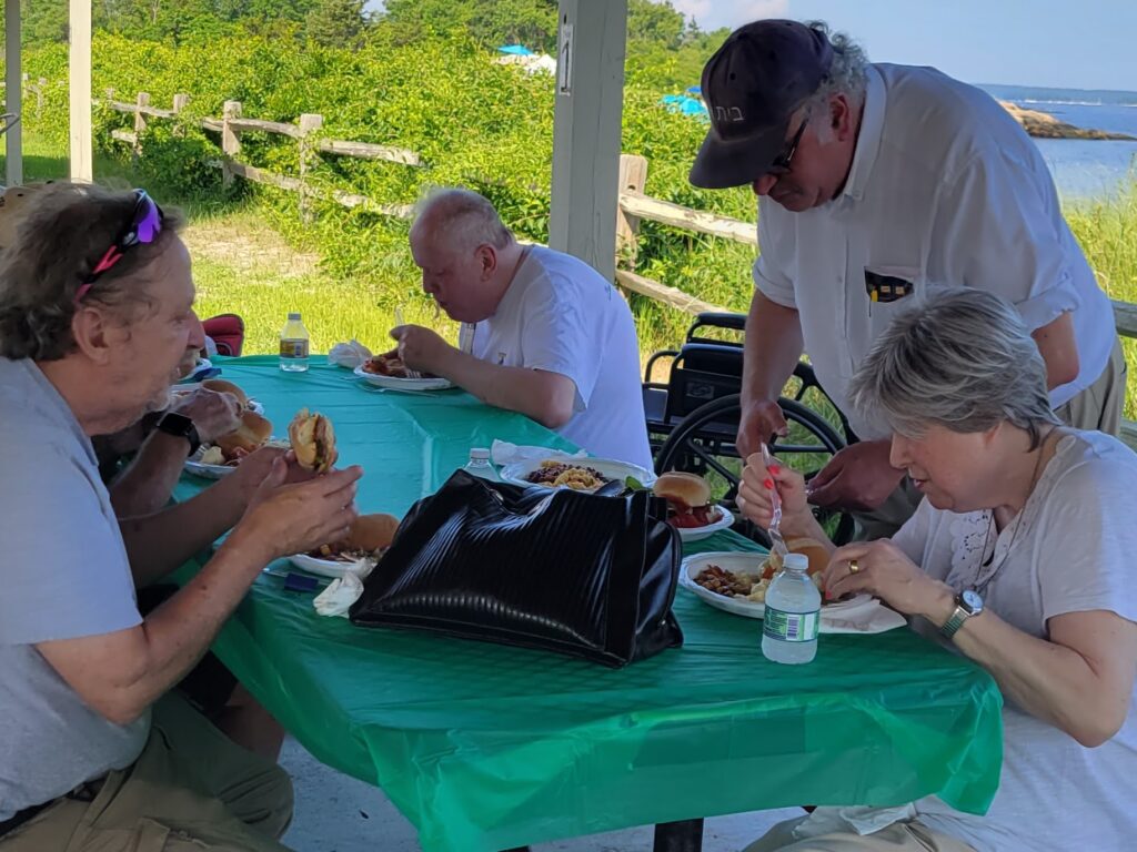 Members dining by the sea